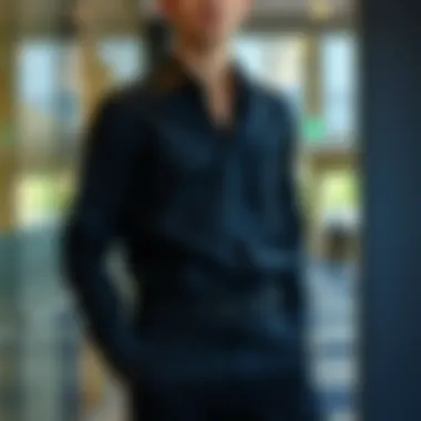 An elegant black shirt paired with formal trousers and accessories