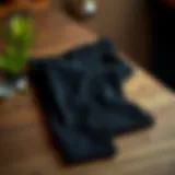 Sophisticated Style of Slim Fit Black Trousers Sophisticated slim fit black trousers on a stylish wooden surface