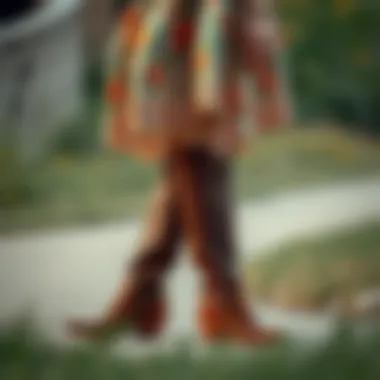 Stylish cowboy boots paired with a floral dress for a bohemian look