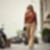 Chic outfit featuring light brown trousers paired with a stylish top