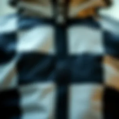 Close-up of the unique fabric texture of the checkered tracksuit.